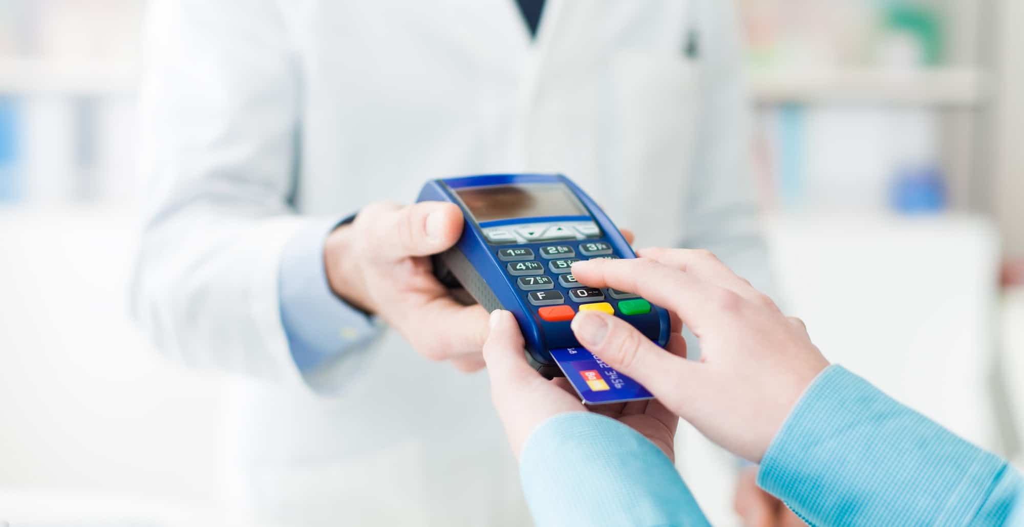 Woman entering a security pin on the terminal
